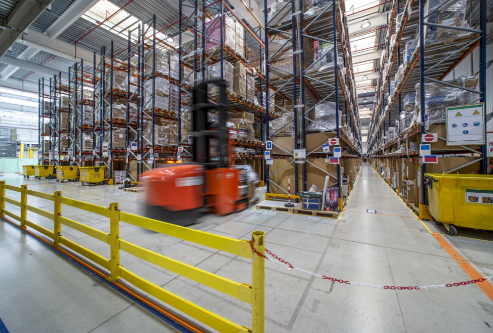 Image of forklift working in inventory based warehouse.